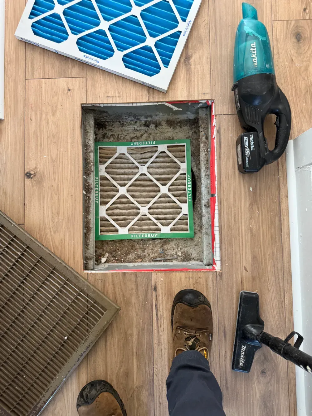The air filter slot of a Fountain Inn system being cleaned out