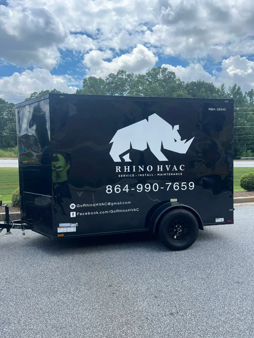 The black Rhino HVAC service trailer parked on a Simpsonville street