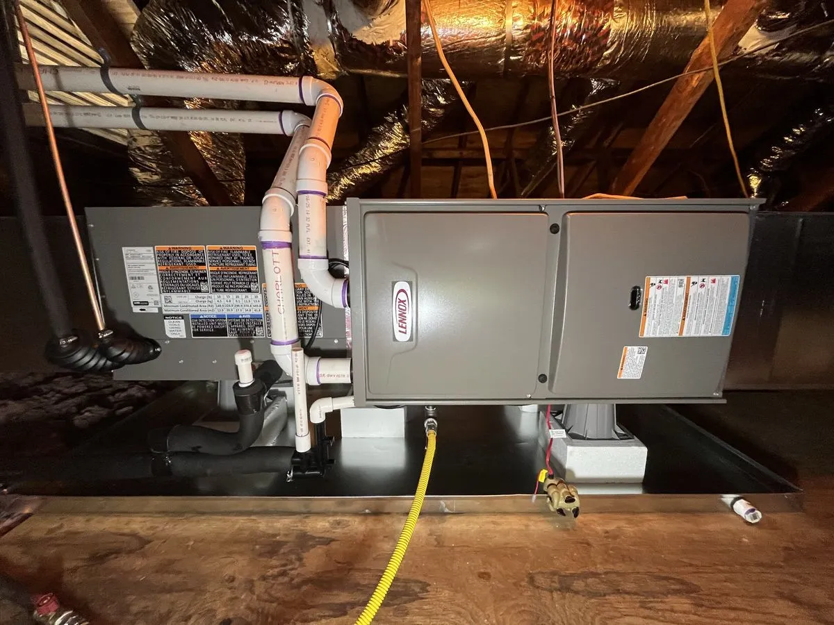 Rhino HVAC technician testing a gas furnace inside a Simpsonville home
