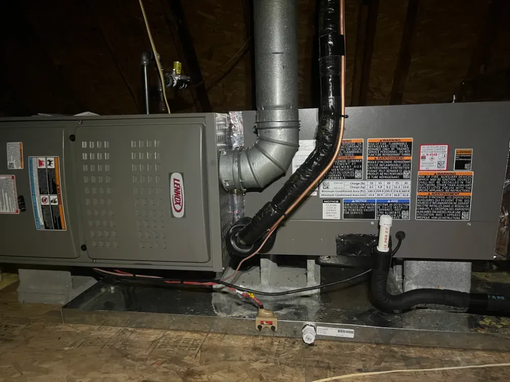 A copper line set running to a Lennox furnace in a Duncan crawl space