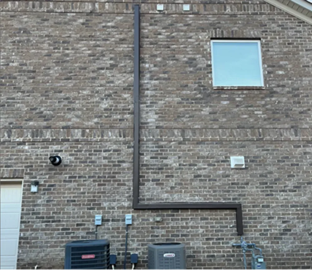 Line hide conduit run down the brick exterior of a Mauldin home