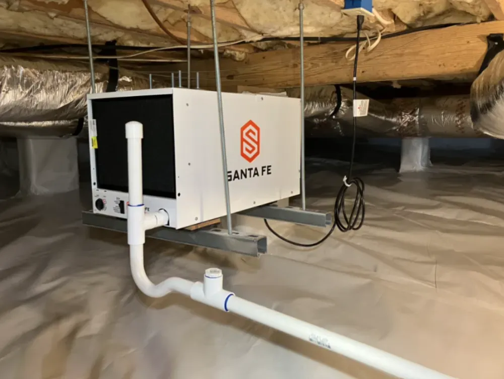A Santa Fe dehumidifier installed in a Woodruff crawl space