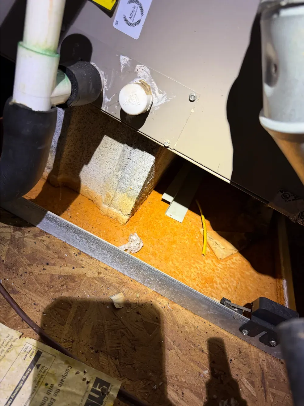Spray foam sealing an insulated access hole in an Easley home